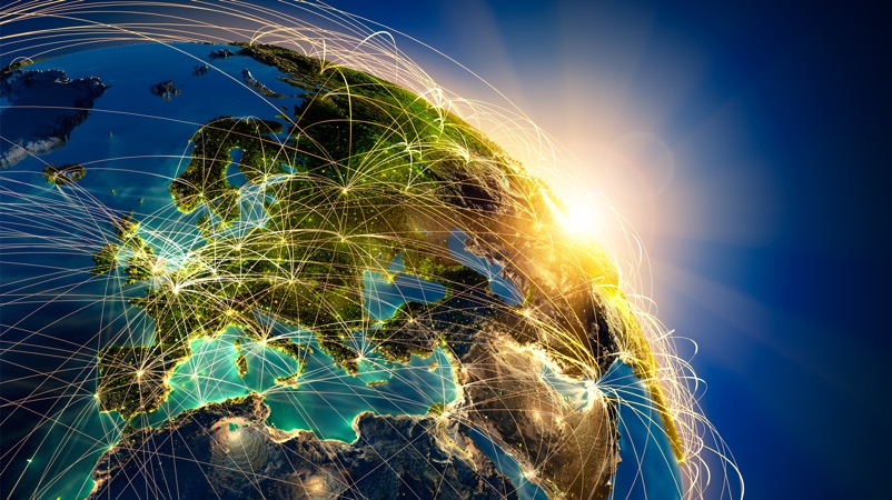 a world globe with strings of light connecting everything
